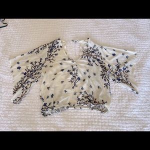 Boutique midi-crop top! Low enough to wear with high wasted or low riding jeans.